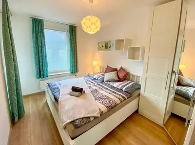 Ein Bett oder Betten in einem Zimmer der Unterkunft Ferienwohnung Maria - by myNests