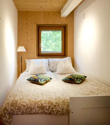 Ein Bett oder Betten in einem Zimmer der Unterkunft Mountains & Lake Boutique Apartment