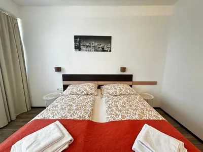 Ein Bett oder Betten in einem Zimmer der Unterkunft Studio65 Vienna