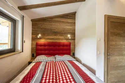 Ein Bett oder Betten in einem Zimmer der Unterkunft AAF - Familien-Chalet Gipfelblick