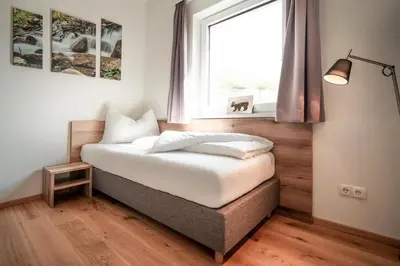 Ein Bett oder Betten in einem Zimmer der Unterkunft Sonnenhang SUN ACKER Apartment