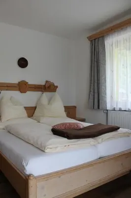 Ein Bett oder Betten in einem Zimmer der Unterkunft Ferienhotel Samerhof