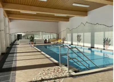 Der Swimmingpool an oder in der Nähe von Spa Apartment in den Alpen
