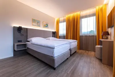 Ein Bett oder Betten in einem Zimmer der Unterkunft Lorenzhaus Exclusive Residence