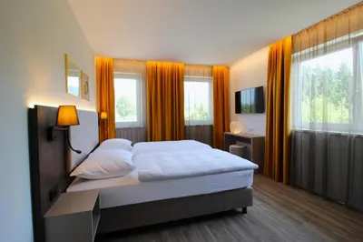 Ein Bett oder Betten in einem Zimmer der Unterkunft Lorenzhaus Exclusive Residence