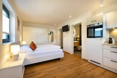 Ein Bett oder Betten in einem Zimmer der Unterkunft S Apartment