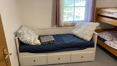 Ein Bett oder Betten in einem Zimmer der Unterkunft Ferienhaus Fuchsbau Hohentauern