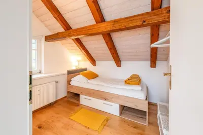 Ein Bett oder Betten in einem Zimmer der Unterkunft Die große Hoamat