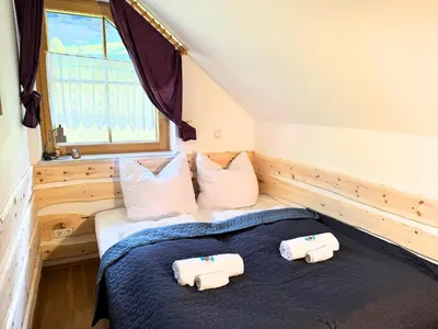 Ein Bett oder Betten in einem Zimmer der Unterkunft Apartment BergWiese 225