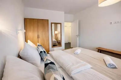 Ein Bett oder Betten in einem Zimmer der Unterkunft Die Malerei Penthouse by Da Alois