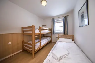 Ein Bett oder Betten in einem Zimmer der Unterkunft Residenz Monica Top 5