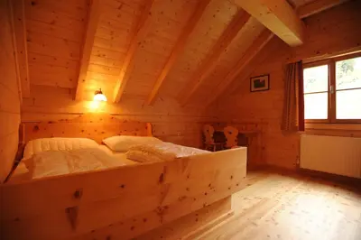 Ein Bett oder Betten in einem Zimmer der Unterkunft Almstallhütte