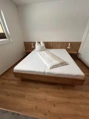 Ein Bett oder Betten in einem Zimmer der Unterkunft Höller's Bergleben