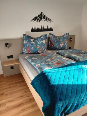 Ein Bett oder Betten in einem Zimmer der Unterkunft Ferienwohnung Kofler