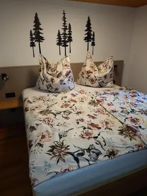 Ein Bett oder Betten in einem Zimmer der Unterkunft Ferienwohnung Kofler