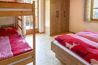 Ein Bett oder Betten in einem Zimmer der Unterkunft Achthütte