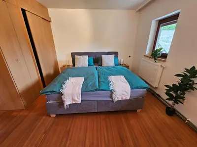 Ein Bett oder Betten in einem Zimmer der Unterkunft Ferienwohnung Hüttenbauer