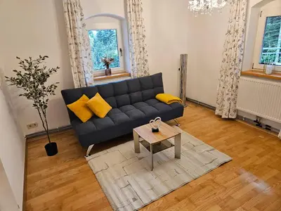 Ein Sitzbereich in der Unterkunft Ferienwohnung Hüttenbauer