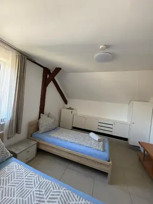 Ein Bett oder Betten in einem Zimmer der Unterkunft TOSKANA Gasthaus