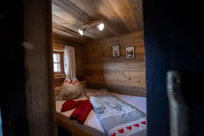 Ein Bett oder Betten in einem Zimmer der Unterkunft Artlieb Hütte