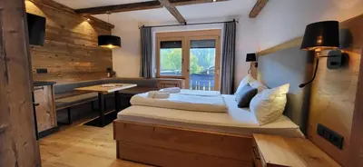 Ein Bett oder Betten in einem Zimmer der Unterkunft Bergidyll 8 by Alpenidyll Apartments