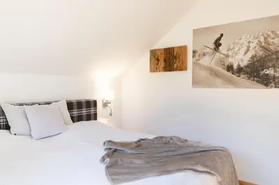 Ein Bett oder Betten in einem Zimmer der Unterkunft Chalet Aineck Snowwhite