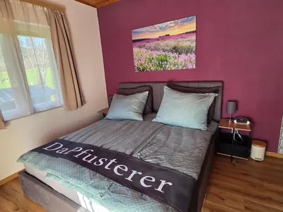 Ein Bett oder Betten in einem Zimmer der Unterkunft Ferienhaus DaPfusterer