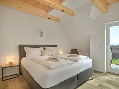 Ein Bett oder Betten in einem Zimmer der Unterkunft Penthouse Cassiopeia by AA Holiday Homes SKI IN SKI OUT