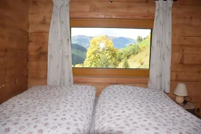 Ein Bett oder Betten in einem Zimmer der Unterkunft Achtchalet
