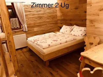 Ein Bett oder Betten in einem Zimmer der Unterkunft Faschinghütte