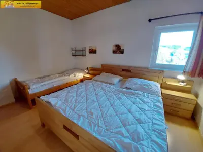Ein Bett oder Betten in einem Zimmer der Unterkunft Apartment Grimmingsuite