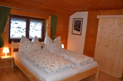 Ein Bett oder Betten in einem Zimmer der Unterkunft FamilienAppartement Waldstüberl