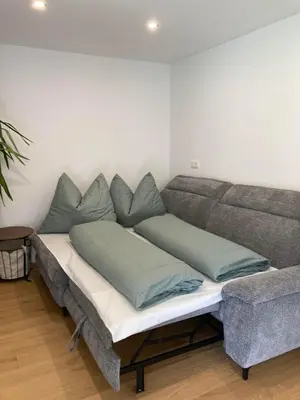 Ein Sitzbereich in der Unterkunft FamilienAppartement Waldstüberl