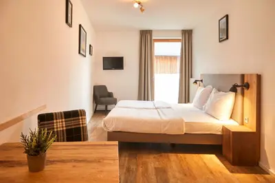 Ein Bett oder Betten in einem Zimmer der Unterkunft Dormio Hotel Obertraun
