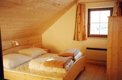 Ein Bett oder Betten in einem Zimmer der Unterkunft Hochsteinhütte am Feuerkogel