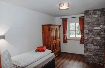 Ein Bett oder Betten in einem Zimmer der Unterkunft Hohlbichlgut