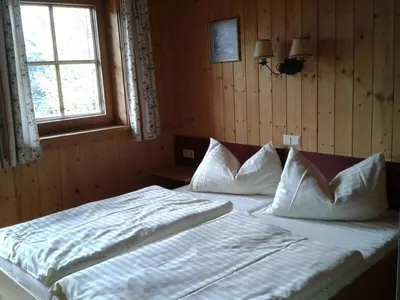 Ein Bett oder Betten in einem Zimmer der Unterkunft Vordergottschallalm