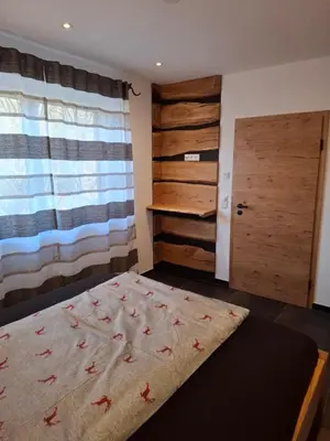 Ein Bett oder Betten in einem Zimmer der Unterkunft Chalet Ausweger - Strobl am Wolfgangsee