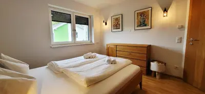 Ein Bett oder Betten in einem Zimmer der Unterkunft LandLiebe Aich by Alpenidyll Apartments