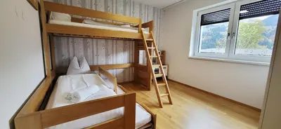 Ein Bett oder Betten in einem Zimmer der Unterkunft LandLiebe Aich by Alpenidyll Apartments