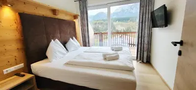 Ein Bett oder Betten in einem Zimmer der Unterkunft Mountain View by Alpenidyll Apartments