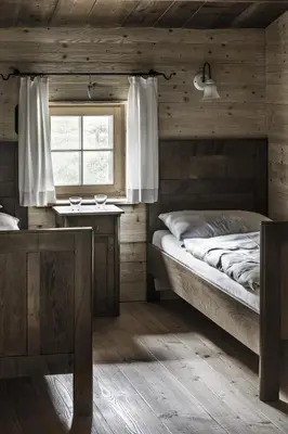 Ein Bett oder Betten in einem Zimmer der Unterkunft Historisches Alpenchalet Käth & Nanei auf Großschlaggut