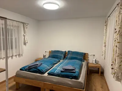 Ein Bett oder Betten in einem Zimmer der Unterkunft Ski und Wander Ferienhäuser Galsterberg-Blick Pruggern - Schladming-Dachstein