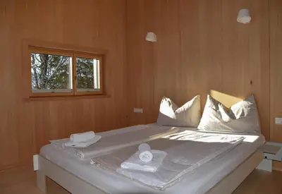 Ein Bett oder Betten in einem Zimmer der Unterkunft Z91 - Skandi-Architektenhaus mit Bergblick