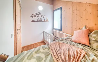 Ein Bett oder Betten in einem Zimmer der Unterkunft 2 Bedroom Awesome Home In Hohentauern