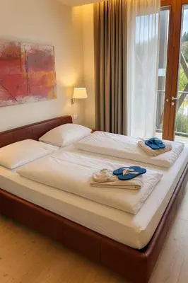 Ein Bett oder Betten in einem Zimmer der Unterkunft Residence Deluxe, 3BR, Balcony, Spa,Ski in-Ski out