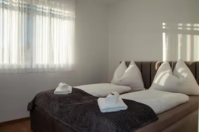 Ein Bett oder Betten in einem Zimmer der Unterkunft Alpen Sky Apartments