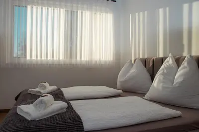 Ein Bett oder Betten in einem Zimmer der Unterkunft Alpen Sky Apartments