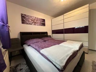 Ein Bett oder Betten in einem Zimmer der Unterkunft Haus Köll - by myNests