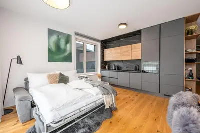Ein Bett oder Betten in einem Zimmer der Unterkunft Mountain Paradise Apartments - by myNests